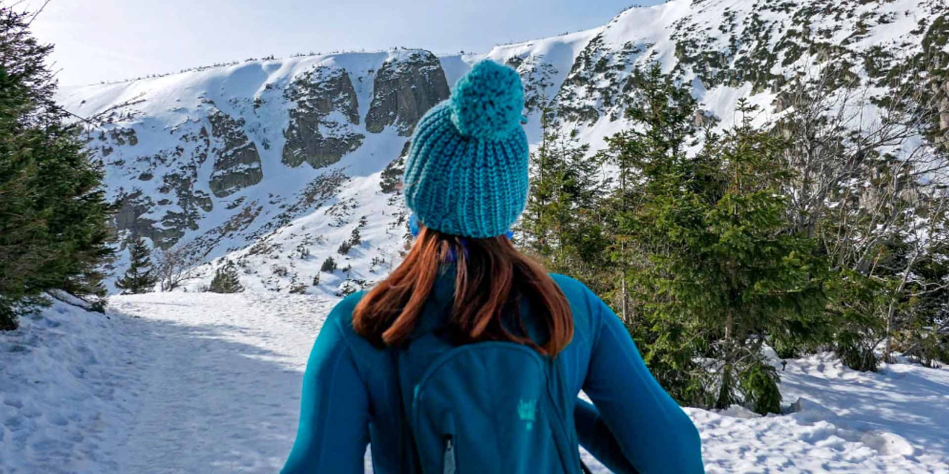 woman-walking-in-snowy-mountains-of-park-city